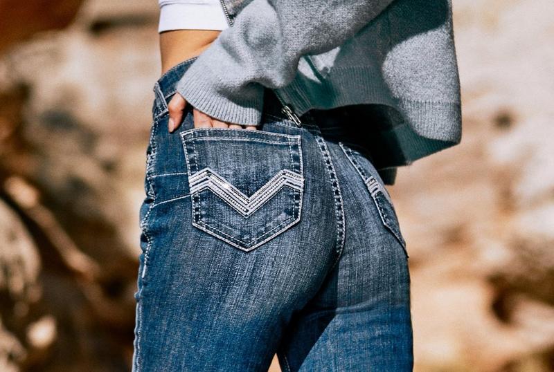 Women in Ariat jeans in desert
